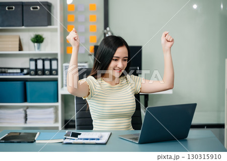 Asian business woman are delighted and happy with the work they do on their tablet, laptop and taking notes Asian business woman are delighted and happy with the work they do on their tablet, laptop and taking notes 130315910