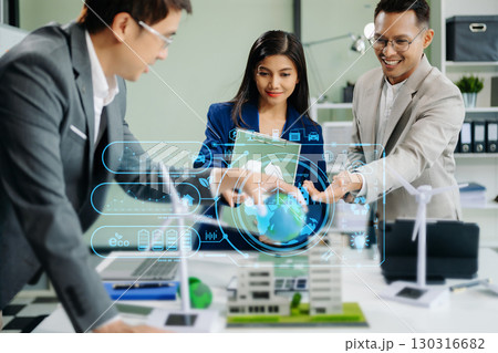 business team people planning and discussing on recycle reduce reuse policy symbol in office meeting room. Green business company business team people planning and discussing on recycle reduce reuse policy symbol in office meeting room. Green business company 130316682