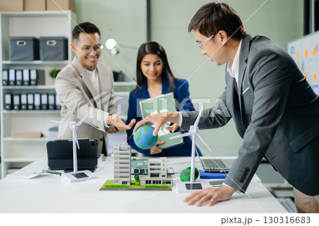 business team people planning and discussing on recycle reduce reuse policy symbol in office meeting room. Green business company business team people planning and discussing on recycle reduce reuse policy symbol in office meeting room. Green business company 130316683