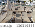 Empty sunbeds and parasols are arranged by a swimming pool at a resort in Lanzarote, Spain. 130319345