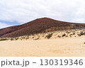 A picturesque view of a volcanic mountain over the beach with golden sand on La Graciosa island. 130319346