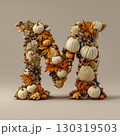 A three-dimensional letter "M" made up of various autumn and nature elements: pumpkins, leaves, pine cones and acorns. All these elements are gathered together to create a feeling of autumn, coziness  130319503