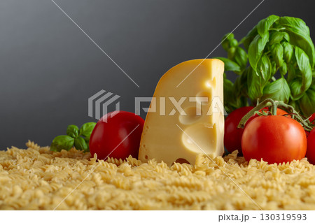 Ingredients for preparing traditional Italian pasta with cheese. 130319593