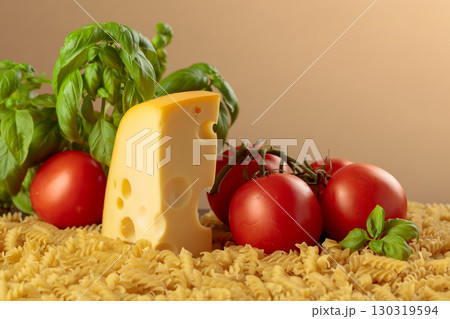 Ingredients for preparing traditional Italian pasta with cheese. 130319594