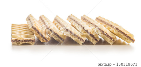 Sweet crispy wafers isolated on white background. Sweet crispy wafers isolated on white background. 130319673