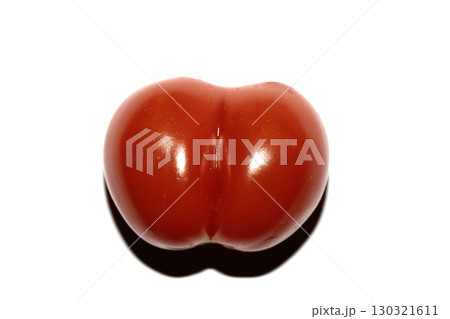 A home grown wonky conjoined tomato that looks funny on a white background A home grown wonky conjoined tomato that looks funny on a white background 130321611