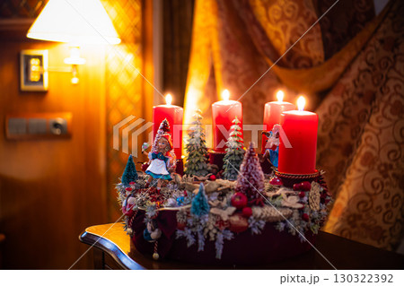 Christmas table composition. Beautiful decoration. Christmas trees, candles, stars, lights and elegant accessories. Merry Christmas and Happy Holidays, Template. 130322392