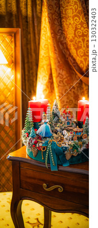 Christmas table composition. Beautiful decoration. Christmas trees, candles, stars, lights and elegant accessories. Merry Christmas and Happy Holidays, Template. 130322403