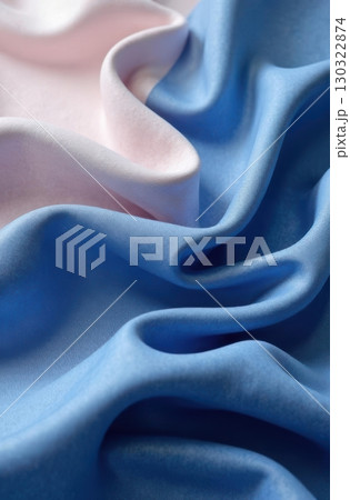 Pastel pink and sky blue silk fabric forming elegant waves Pastel pink and sky blue silk fabric forming elegant waves 130322874