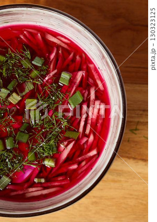 Vibrant and Colorful Beetroot Salad Accompanied by Fresh Herbs and Flavorful Onions 130323125