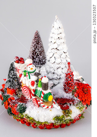 Christmas tree table handmade arrangement mini decoration for new year artificial on white background isolated Christmas tree table handmade arrangement mini decoration for new year artificial on white background isolated 130323507