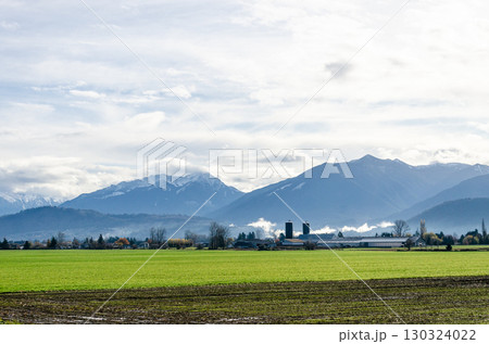 View of rural canada on Highway from Abbotsford to Hope,   BC, Canada with mountains, valleys and farms in the background 130324022