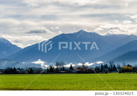 View of rural canada on Highway from Abbotsford to Hope,   BC, Canada with mountains, valleys and farms in the background 130324023