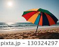 Multicolored Sun Umbrella at Angle on Beach 130324297