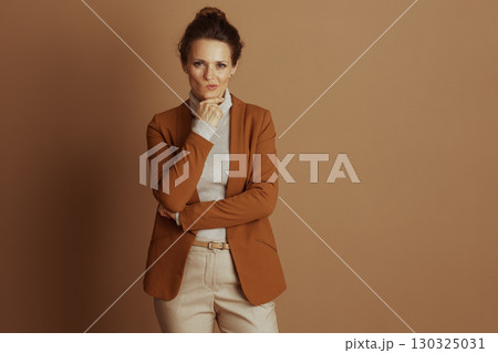 Pensive Businesswoman with Hand on Chin 130325031