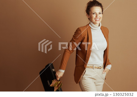 Confident Professional with Briefcase and Autumn Style Confident Professional with Briefcase and Autumn Style 130325032