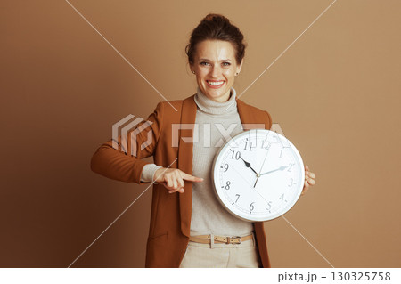 Businesswoman Emphasizing Punctuality and Time 130325758