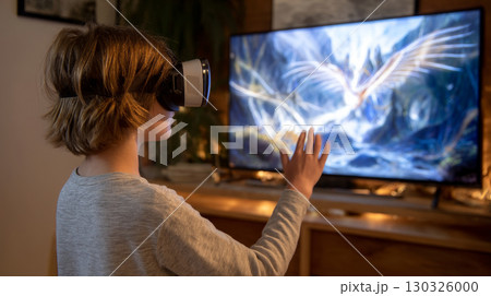 Child using virtual reality headset for metaverse, child looking into VR glasses. Little girl boy with futuristic glasses having fun, teenager playing video games. Technology, simulator, oculus future 130326000