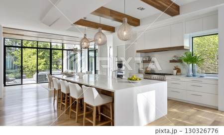 Interior of a modern kitchen with a dining table, chairs, white countertops and a lamp. Concept of buying a new home, an apartment or a house, housewarming and renovation 130326776