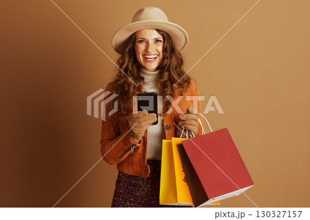 Stylish Woman with Phone and Autumn Shopping Haul Stylish Woman with Phone and Autumn Shopping Haul 130327157