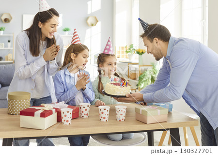 Happy family enjoy birthday party at home 130327701