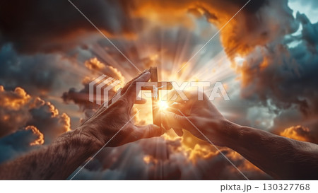 hands holding christian wooden cross with sunlight. religious concept of prayer 130327768