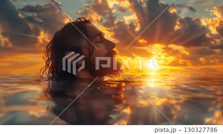 Serene depiction of a figure resembling a religious leader emerging from tranquil waters at dawn 130327786