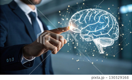 Businessman touching digital brain network hologram conveying innovation and neural technology inspiration with glowing connection 130329168