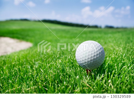 Golf ball on tee Golf ball on tee 130329589