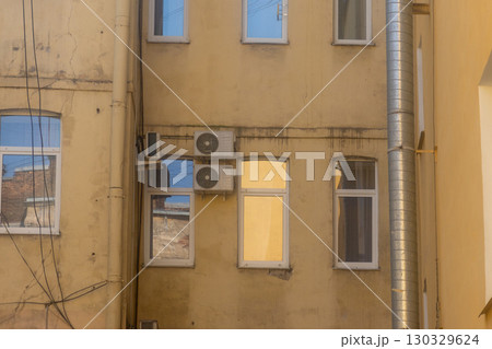 air conditioners are mounted on the wall. technologies for air cooling in hot weather. 130329624