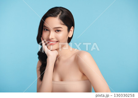Beautiful Young transgender woman with clean fresh skin on blue background, Face care, Facial treatment, Cosmetology, beauty and spa, transgender women portrait. Beautiful Young transgender woman with clean fresh skin on blue background, Face care, Facial treatment, Cosmetology, beauty and spa, transgender women portrait. 130330258