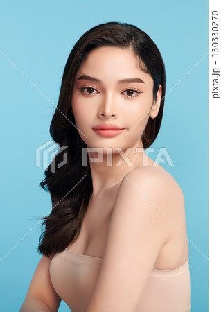 Beautiful Young transgender woman with clean fresh skin on blue background, Face care, Facial treatment, Cosmetology, beauty and spa, transgender women portrait. Beautiful Young transgender woman with clean fresh skin on blue background, Face care, Facial treatment, Cosmetology, beauty and spa, transgender women portrait. 130330270