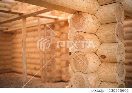 Wooden house building, house made of rounded logs, ecological house 130330602