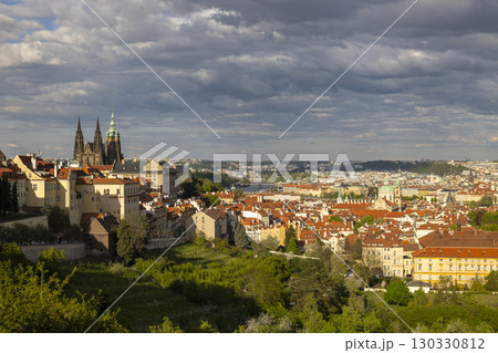 Prague cityscape featuring St. Vitus Cathedral under cloudy sky, Czechia 130330812