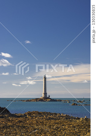 Goury Lighthouse standing on a small island in Normandy, France 130330835