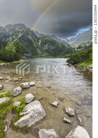 Rainbow over Popradske pleso mountain lake in High Tatras, Slovakia Rainbow over Popradske pleso mountain lake in High Tatras, Slovakia 130330944