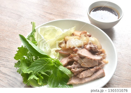 fried beef meat brisket with fresh vegetable on plate dipping Thai spicy sauce  130331076
