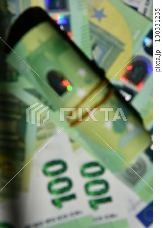 Euro money blurry background showcasing denomination details and holographic patterns to highlight currency design elements 130331235
