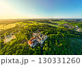 Holy Mountain in Pribram, Czechia serves as a Baroque pilgrimage complex surrounded by lush landscapes. Visitors admire the architecture and tranquil nature during sunny days. 130331260