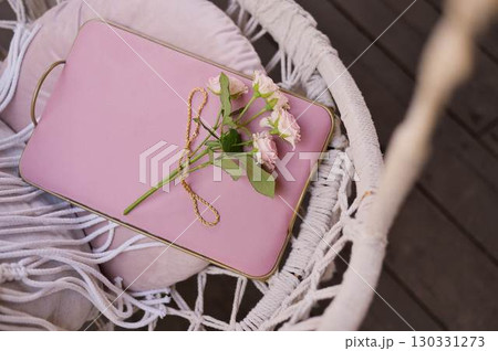Roses on a pastel pink tray. Soft, delicate shades. Background image 130331273