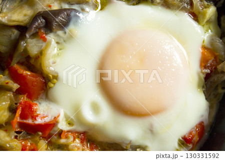 Cooked vegetables with poached egg Cooked vegetables with poached egg 130331592