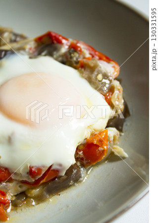 Cooked vegetables with poached egg Cooked vegetables with poached egg 130331595