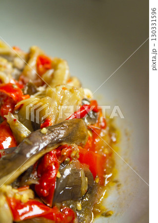 Cooked vegetables with poached egg 130331596