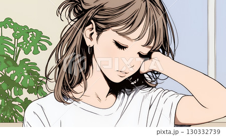 髪をかきあげている（なでている）若い女性