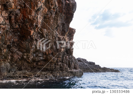 A breathtaking view capturing the rugged majesty of a coastal sea cliff A breathtaking view capturing the rugged majesty of a coastal sea cliff 130333486