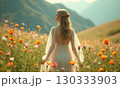 Woman stands to field of flowers in light transparent summer dress. Concept of tranquility, serenity 130333903