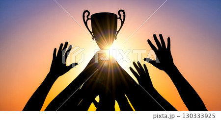 Silhouette of hands lifting trophy against bright sun flare, iconic victory and success concept, team celebrating championship award at sunset with starburst. Silhouette of hands lifting trophy against bright sun flare, iconic victory and success concept, team celebrating championship award at sunset with starburst. 130333925