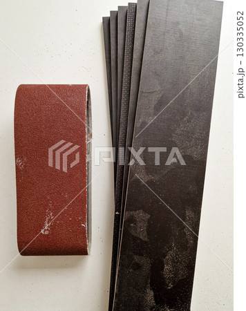 Stack of Wooden Planks with Sandpaper for DIY Woodworking 130335052