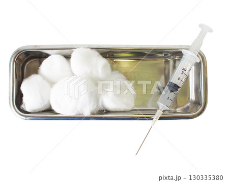 Cotton balls in stainless tray with syringe isolated on white background Cotton balls in stainless tray with syringe isolated on white background 130335380