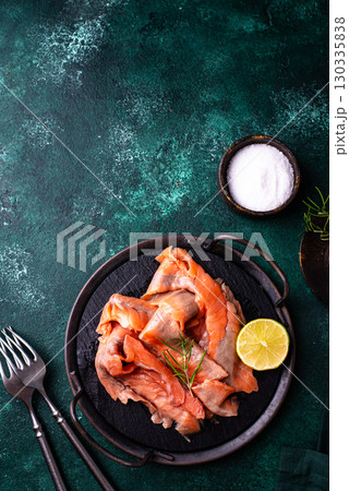 Salted sliced salmon fish with herbs Salted sliced salmon fish with herbs 130335838